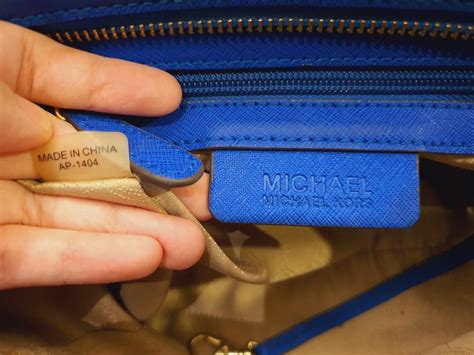 how to tell if a purse is real michael kors|michael kors serial number.